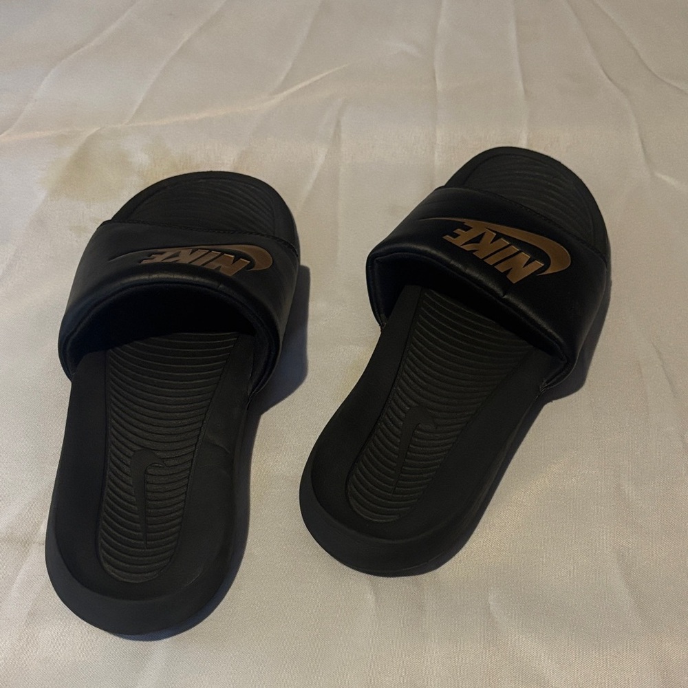 Nike Black Slides with Gold Logo